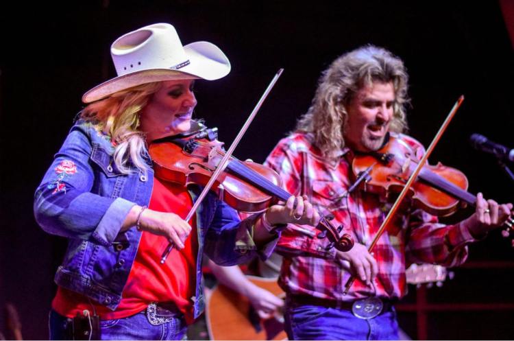 Twin fiddles, Melody & Wayne Massengale take the lead in their all-star family band